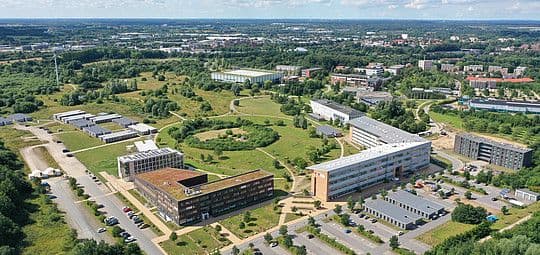 Main campus building of Flensburg University, Germany, featuring modern architecture and green spaces.