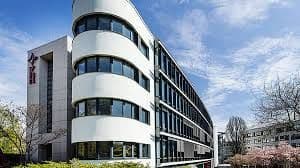 Mainz Catholic University of Applied Sciences campus view showing modern buildings, students, and green spaces in Mainz, Germany.