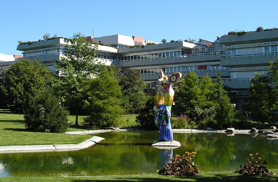 Campus view of University of Ulm showing modern academic buildings, green spaces, and student facilities.