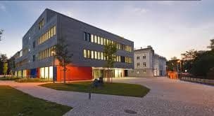 Augsburg University of Technology campus with modern classrooms, laboratories, and students engaged in applied learning.