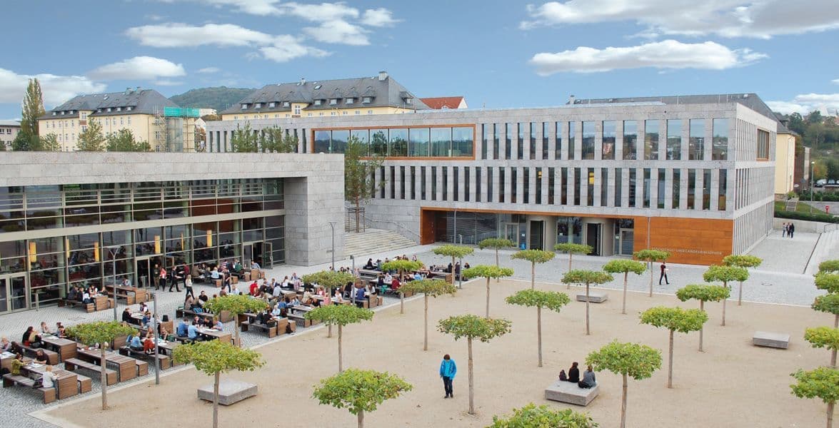 Fulda University of Applied Sciences campus view in Fulda, Germany, showing modern buildings, students, and green spaces.